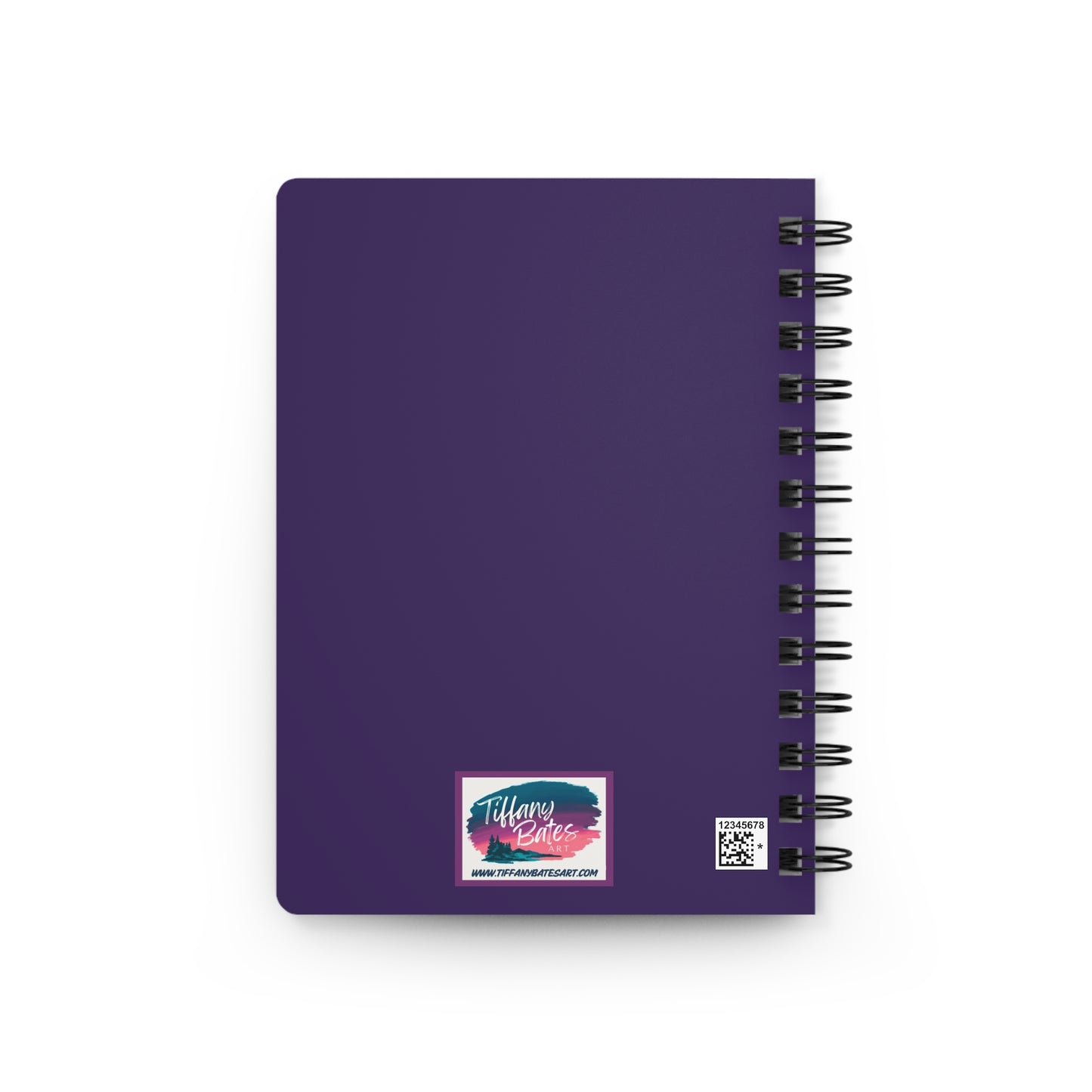 Back of notebook with purple cover and logo