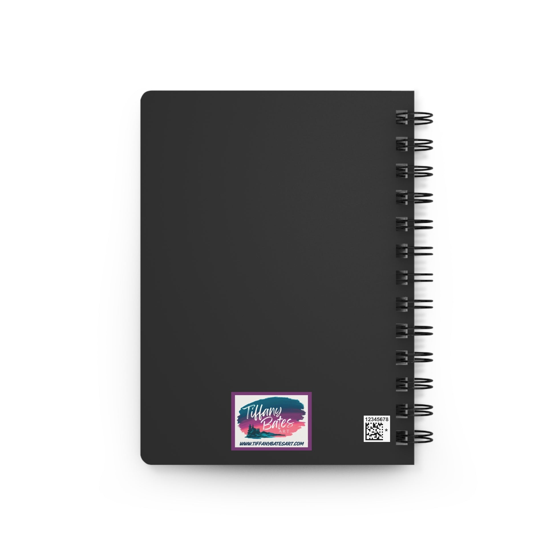 Dark grey back cover of notebook with artist logo