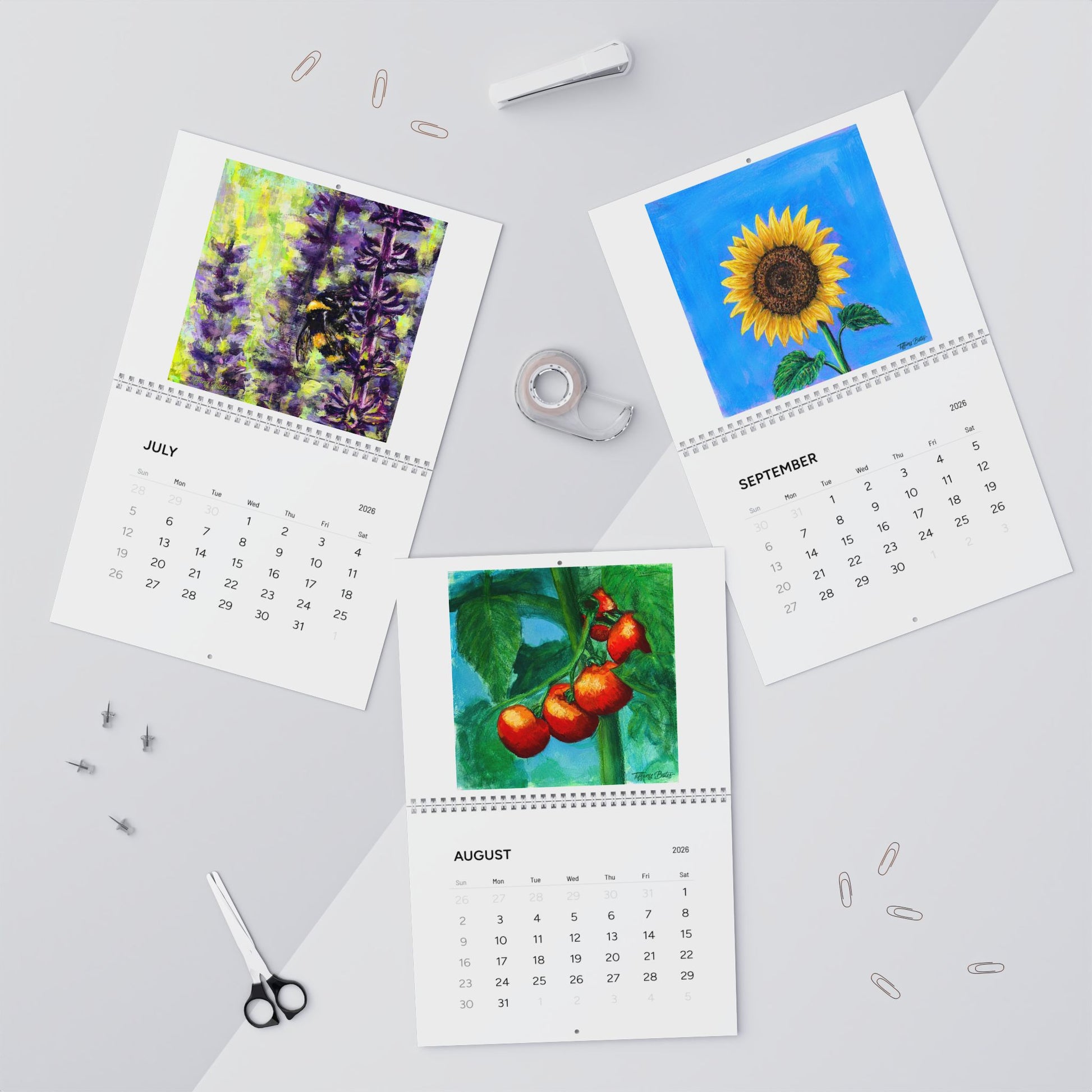 Three calendar pages showing July, August, and September with floral and fruit images on a light gray background.