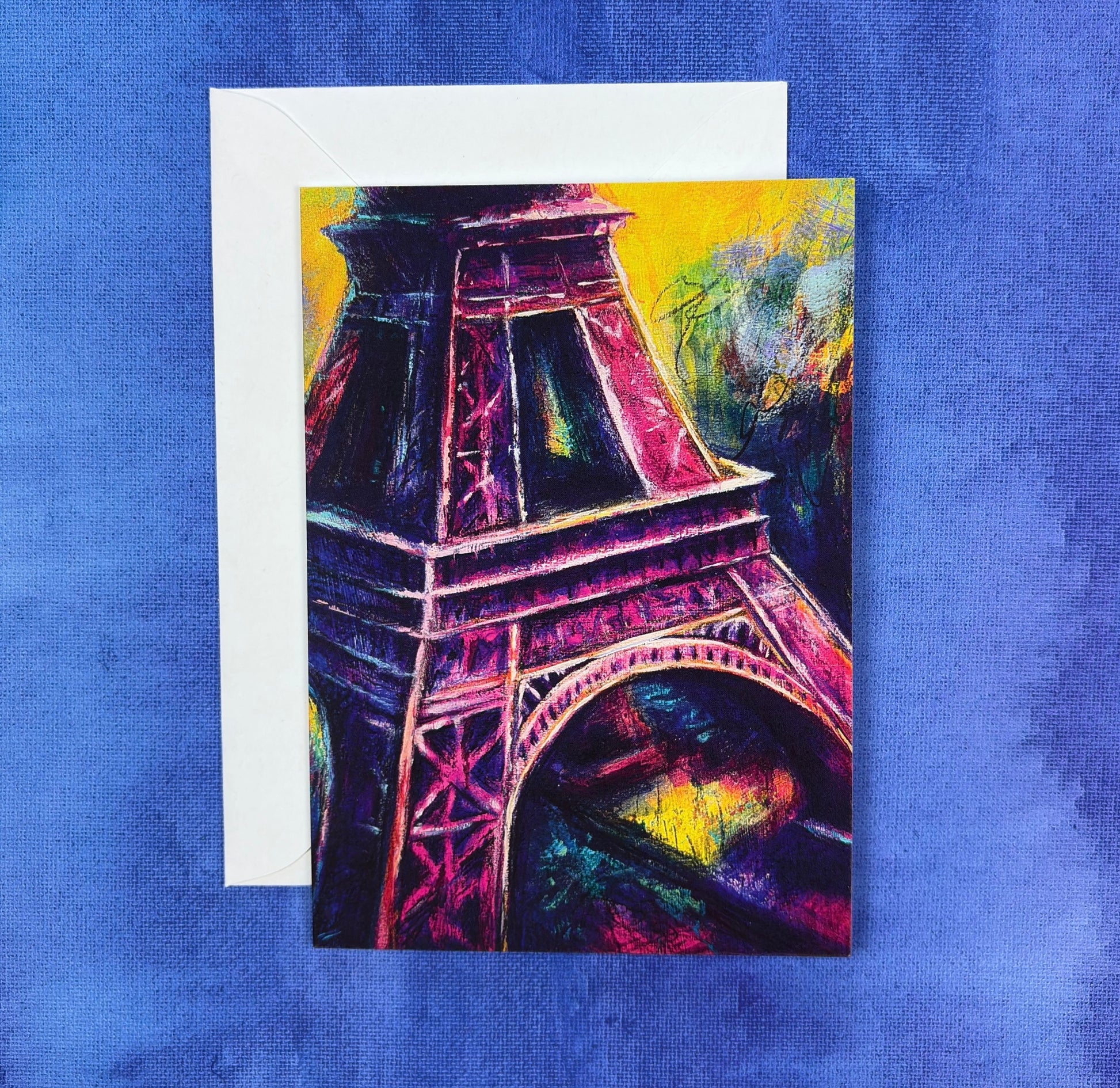 Colorful vibrant Eiffel Tower painting with pinks and yellows and purple on a blue textured background