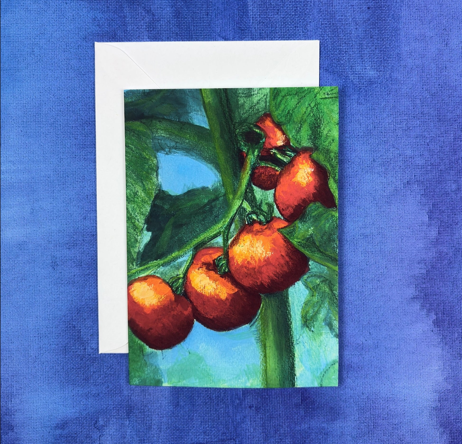 Greeting Card with painting of red tomatoes on a green vine against a blue background