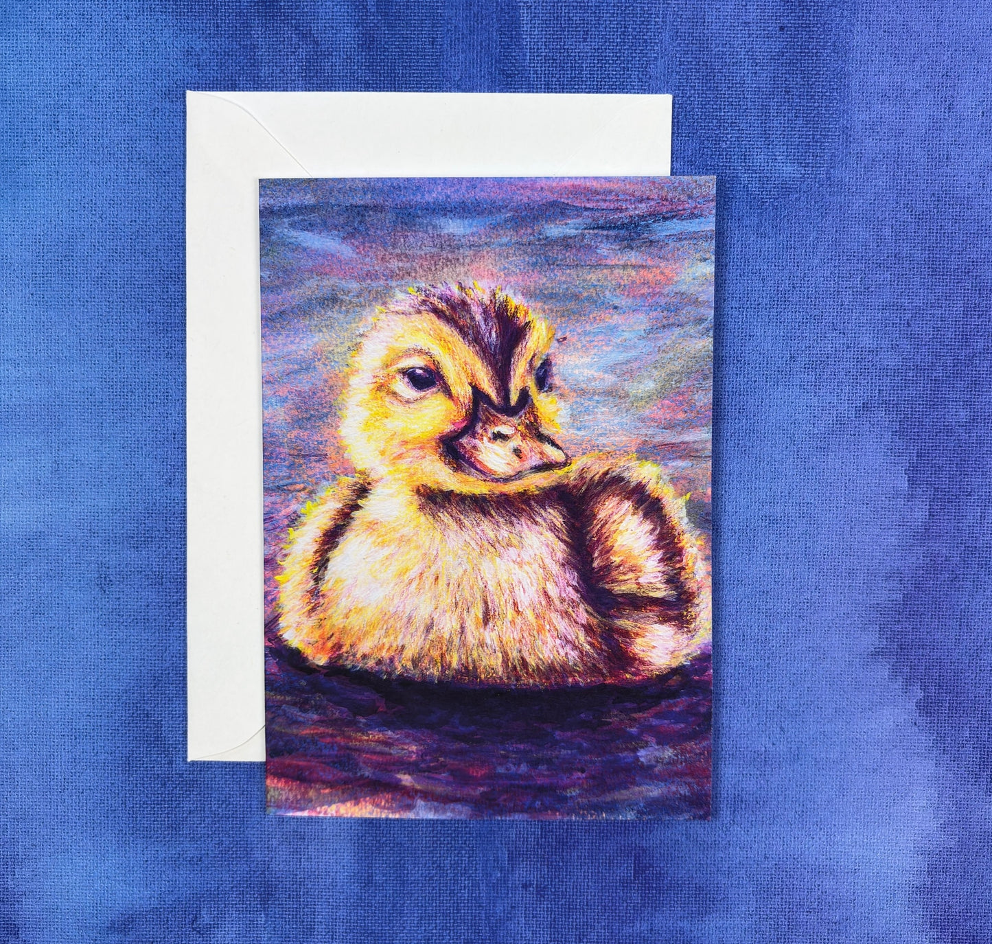 Greeting card with a vibrant colorful painting of a duckling on a blue and purple background