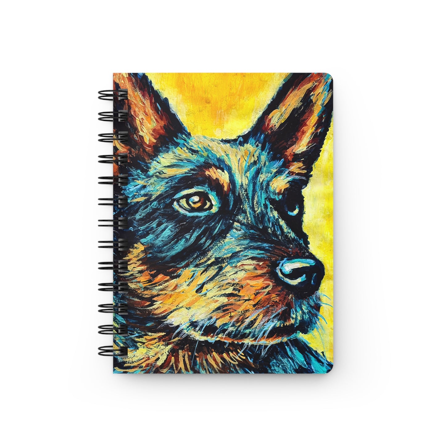 A spiral notebook with a colorful artistic portrait of a Blue Heeler dog on the cover.