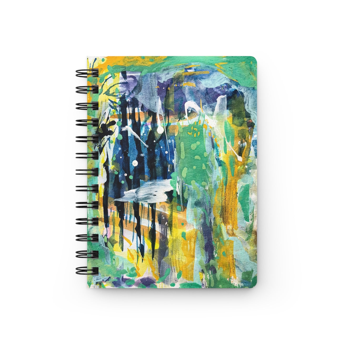 A spiral notebook with a colorful abstract pattern on the cover with green yellow blue and white 