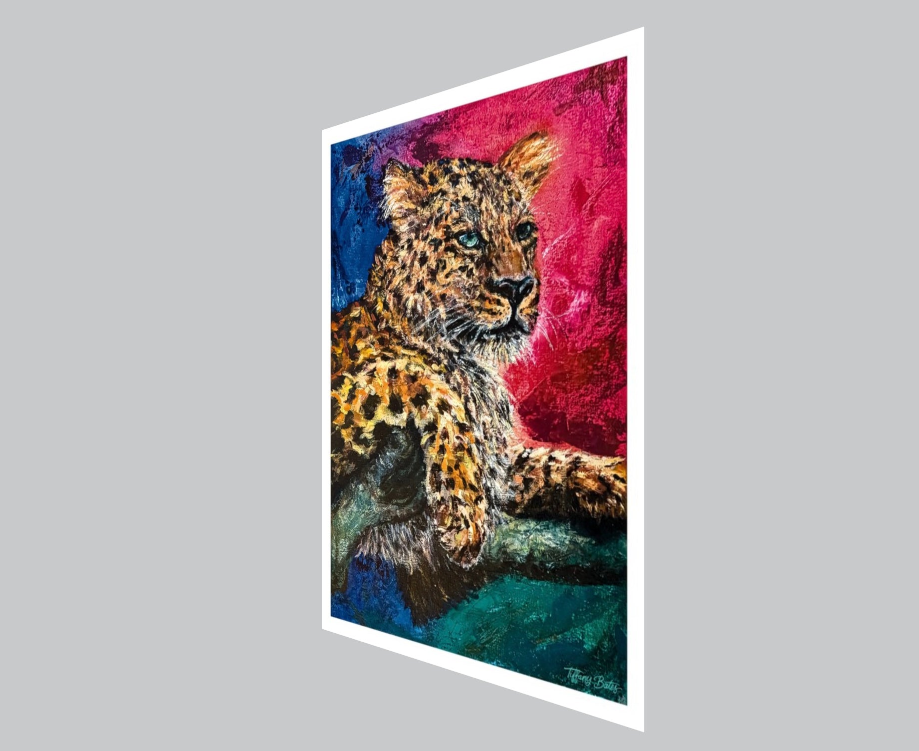 Angled view of A fine art print of a vibrant oil painting, a Jaguar in a vibrant colors, with a mix of pink, blue, and yellow creating a striking visual effect. The Jaguar is depicted in a resting pose against an abstract background.
